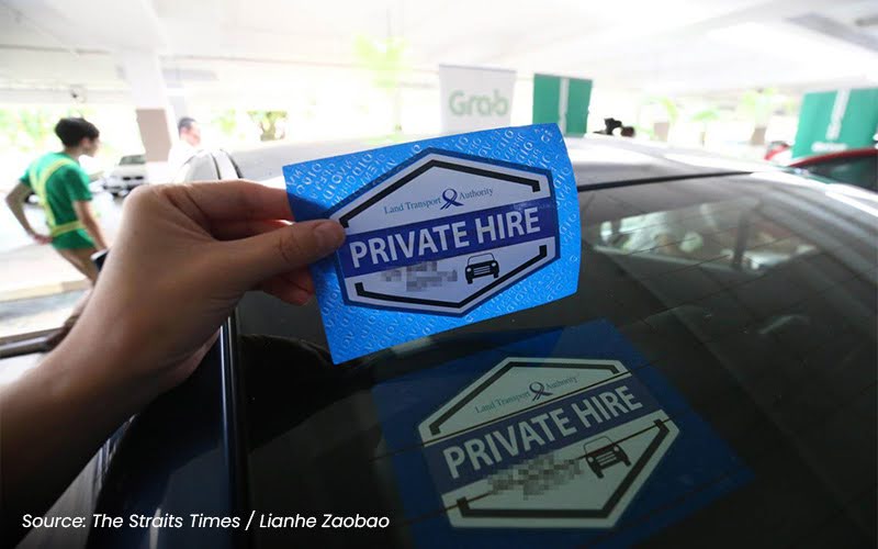 Private hire vehicle decal held in front of car window
