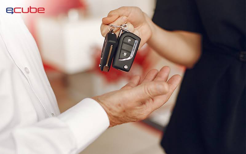 Rental car keys being handed over to customer 
