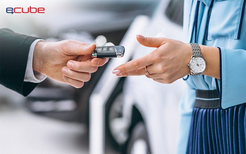 person receiving the key to the rental car