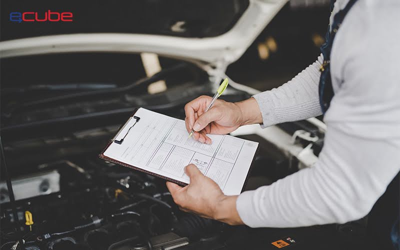 person with a checklist inspecting a rental car